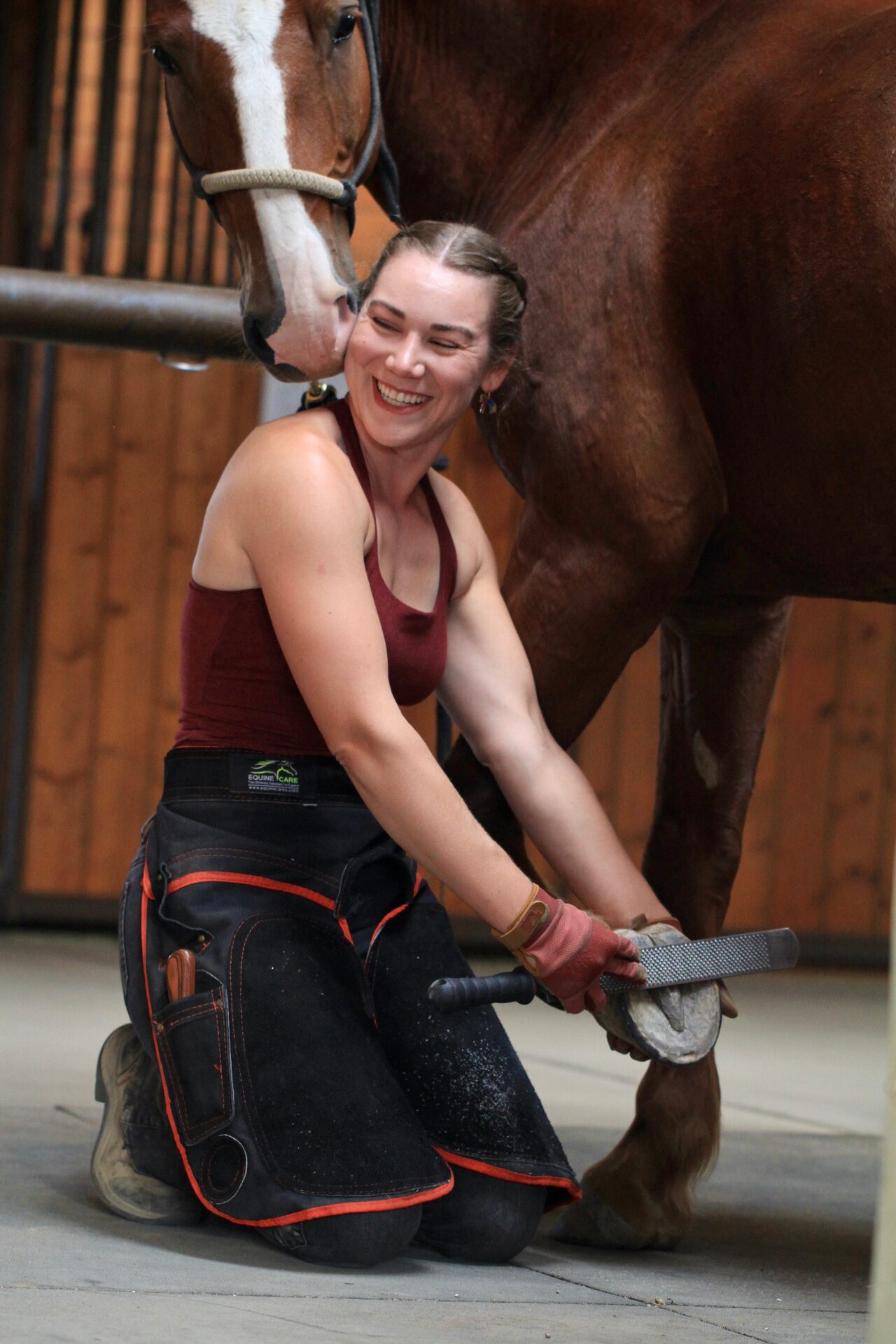 Alex Crenshaw trimming a horse's hoof