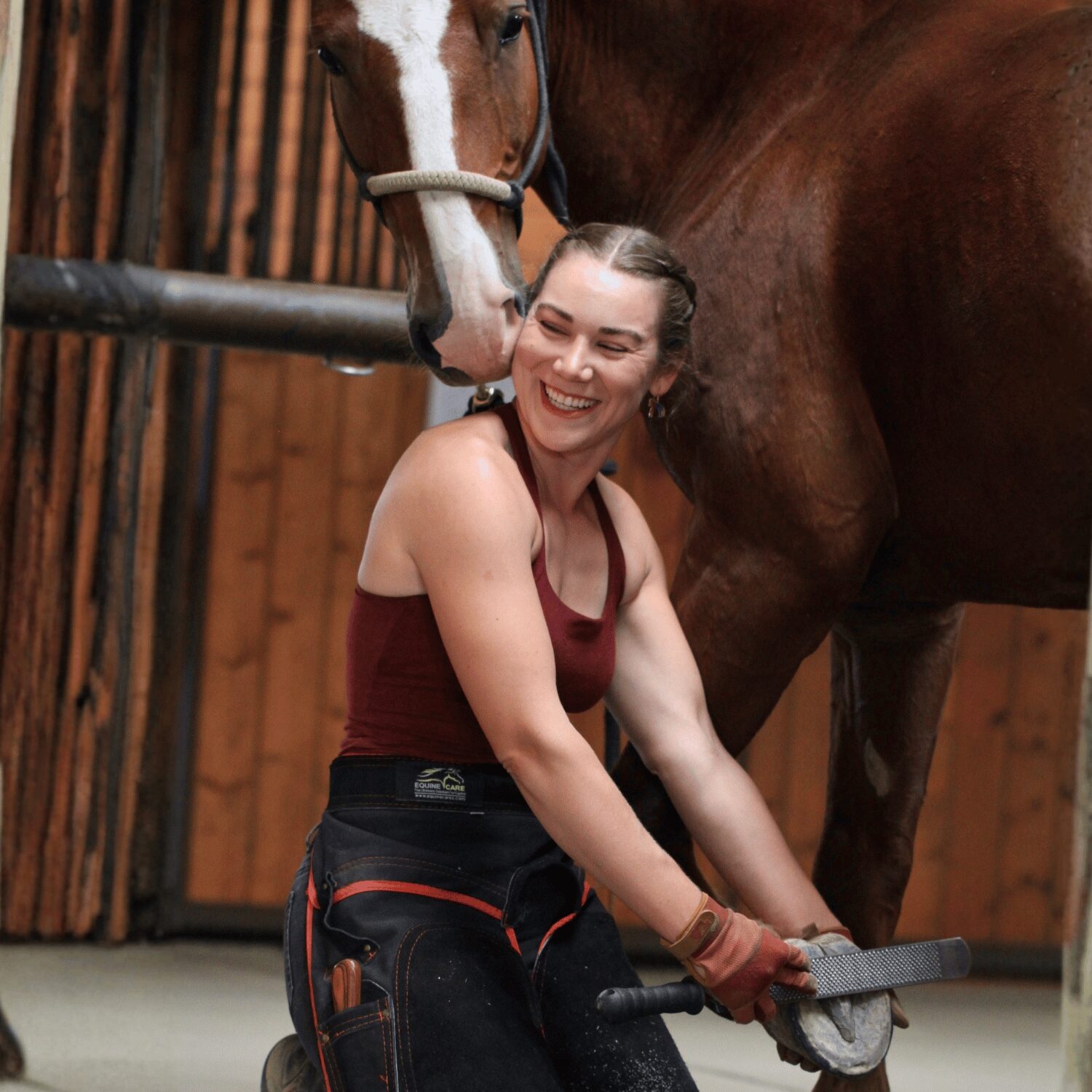 Alex Crenshaw trimming a horse's hoof